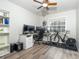 Home office with dual monitors, a bike trainer, and ample storage at 2855 Cady Way, Winter Park, FL 32792
