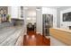 Modern kitchen with stainless steel appliances, granite counters, and white cabinets at 2855 Cady Way, Winter Park, FL 32792