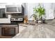 Stainless steel appliances and granite countertops in a corner kitchen setting at 2855 Cady Way, Winter Park, FL 32792