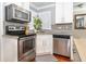 Modern kitchen with stainless steel appliances and granite countertops at 2855 Cady Way, Winter Park, FL 32792