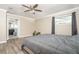 Main bedroom with ensuite bathroom access and ceiling fan at 2855 Cady Way, Winter Park, FL 32792
