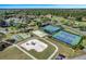 Community recreational area including tennis courts, playground, and basketball court at 2923 Marshfield Ct # Ge, Orlando, FL 32822