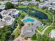 Community pool and clubhouse with lake view at 2923 Marshfield Ct # Ge, Orlando, FL 32822
