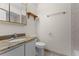 Bathroom featuring vanity with stone countertops, toilet, mirrored cabinet, and tile floors at 2923 Marshfield Ct # Ge, Orlando, FL 32822