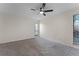 Bedroom featuring carpet flooring, a ceiling fan, and natural light from two large windows at 2923 Marshfield Ct # Ge, Orlando, FL 32822