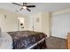 Second bedroom with a ceiling fan and large window at 2923 Marshfield Ct # Ge, Orlando, FL 32822