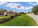 Ventura Country Club entrance with flag and landscaping at 2923 Marshfield Ct # Ge, Orlando, FL 32822