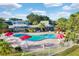 Freeform pool with surrounding patio and clubhouse at 2923 Marshfield Ct # Ge, Orlando, FL 32822