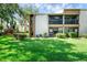 Attractive condo building with lush landscaping at 2923 Marshfield Ct # Ge, Orlando, FL 32822