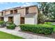 Charming townhouse featuring well-maintained landscaping and a welcoming entrance, perfect for suburban living at 2923 Marshfield Ct # Ge, Orlando, FL 32822