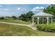 Relaxing gazebo overlooking a serene pond at 2923 Marshfield Ct # Ge, Orlando, FL 32822