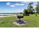 Community grill overlooking the lake, perfect for BBQs at 2923 Marshfield Ct # Ge, Orlando, FL 32822