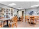 Community library with tables, chairs, and bookshelves at 2923 Marshfield Ct # Ge, Orlando, FL 32822