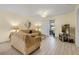 Living room with beige couch, coffee table, and flat-screen TV at 2923 Marshfield Ct # Ge, Orlando, FL 32822