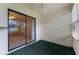 Enclosed patio with ceiling fan, textured wall, and sliding glass doors offering serene outdoor access at 2923 Marshfield Ct # Ge, Orlando, FL 32822