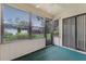 Enclosed patio with large windows offering a view to the yard and providing an airy atmosphere at 2923 Marshfield Ct # Ge, Orlando, FL 32822