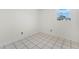 Laundry area with tiled floor and a window at 2943 Elkcam Blvd, Deltona, FL 32738