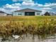 House with a large backyard and water view at 306 Quarry Rock Cir, Kissimmee, FL 34758