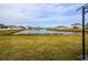 Spacious backyard overlooking a lake and community homes at 306 Quarry Rock Cir, Kissimmee, FL 34758