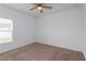 Simple bedroom with ceiling fan and neutral decor at 306 Quarry Rock Cir, Kissimmee, FL 34758
