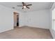 Bright bedroom with ceiling fan and access to closet at 306 Quarry Rock Cir, Kissimmee, FL 34758