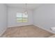 Bright dining room with neutral decor, carpeting, and a lake view at 306 Quarry Rock Cir, Kissimmee, FL 34758