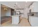 Modern kitchen with white cabinets, stainless steel appliances, and an island at 306 Quarry Rock Cir, Kissimmee, FL 34758