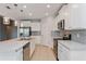 Modern kitchen with white cabinets, stainless steel appliances, and an island at 306 Quarry Rock Cir, Kissimmee, FL 34758
