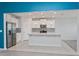 Modern kitchen with white cabinets, stainless steel appliances, and an island at 306 Quarry Rock Cir, Kissimmee, FL 34758