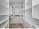 Large walk-in closet with ample shelving and drawers at 306 Quarry Rock Cir, Kissimmee, FL 34758