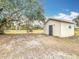 Large backyard with shed and grill, providing ample outdoor space at 3074 Messina Ave, Orlando, FL 32811