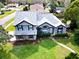 Two-story house with gray roof, landscaping, and walkway at 309 Oakwood Ct, Lake Mary, FL 32746