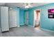 Light blue bedroom with wood-look floors and ensuite bathroom at 309 Oakwood Ct, Lake Mary, FL 32746