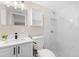 Updated bathroom with a white marble shower and vanity at 32650 Azealia Pl, Tavares, FL 32778