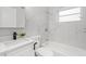 Clean bathroom with a white bathtub and vanity at 32650 Azealia Pl, Tavares, FL 32778