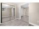 Bedroom with mirrored closet and access to bathroom at 32650 Azealia Pl, Tavares, FL 32778
