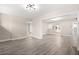 Open living area with light walls and laminate flooring at 32650 Azealia Pl, Tavares, FL 32778