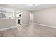 Open concept living room and kitchen with laminate flooring at 32650 Azealia Pl, Tavares, FL 32778