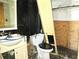 Bathroom with damaged vanity and toilet next to the shower with missing doors; showing visible signs of disrepair at 3421 Fudge Rd, Apopka, FL 32712