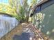 Side of home showing the exterior wall and access to the backyard at 3421 Fudge Rd, Apopka, FL 32712