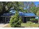 Cozy single-story home with a well-maintained lawn and mature trees, offering a comfortable and inviting curb appeal at 3421 Fudge Rd, Apopka, FL 32712