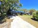 Charming single-story home featuring a spacious front yard, mature trees, and a long driveway leading to the entrance at 3421 Fudge Rd, Apopka, FL 32712