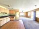 Open-concept interior awaiting renovation, boasting ample natural light, cabinetry, and potential for a modern design at 3421 Fudge Rd, Apopka, FL 32712