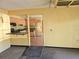 View of kitchen with wood cabinets and black appliances at 3421 Fudge Rd, Apopka, FL 32712