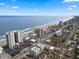 Aerial perspective of oceanfront buildings and street at 3799 S Atlantic Ave # 602, Daytona Beach, FL 32118