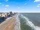 Beachfront aerial view showcasing the coastline and buildings at 3799 S Atlantic Ave # 602, Daytona Beach, FL 32118