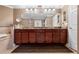 Double vanity, granite countertop, cherry cabinets at 3799 S Atlantic Ave # 602, Daytona Beach, FL 32118