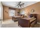 Two twin beds in a well-lit bedroom with carpeted floor and ceiling fan at 3799 S Atlantic Ave # 602, Daytona Beach, FL 32118