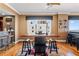 Bright dining area showcasing a rustic wood table and hardwood floors at 3799 S Atlantic Ave # 602, Daytona Beach, FL 32118
