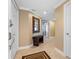 Light and airy entryway with tile floors and bench at 3799 S Atlantic Ave # 602, Daytona Beach, FL 32118